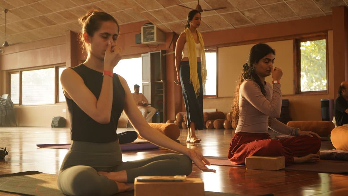 Guests practising pranayama in the yoga hall