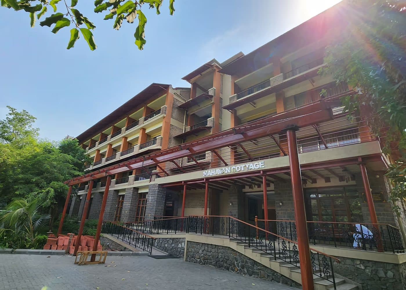 The Mahavan building, three storeys of balconies among trees